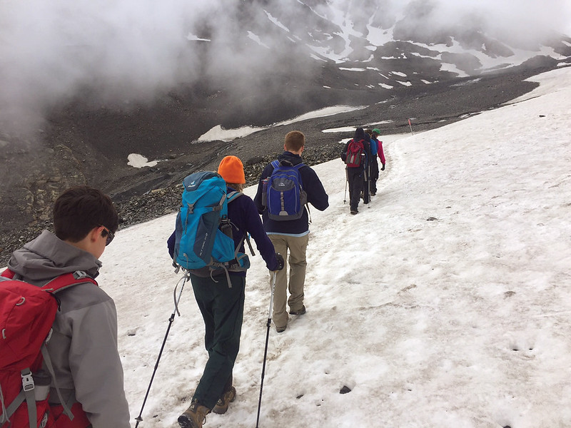 Scouts hiking on snow covered path
